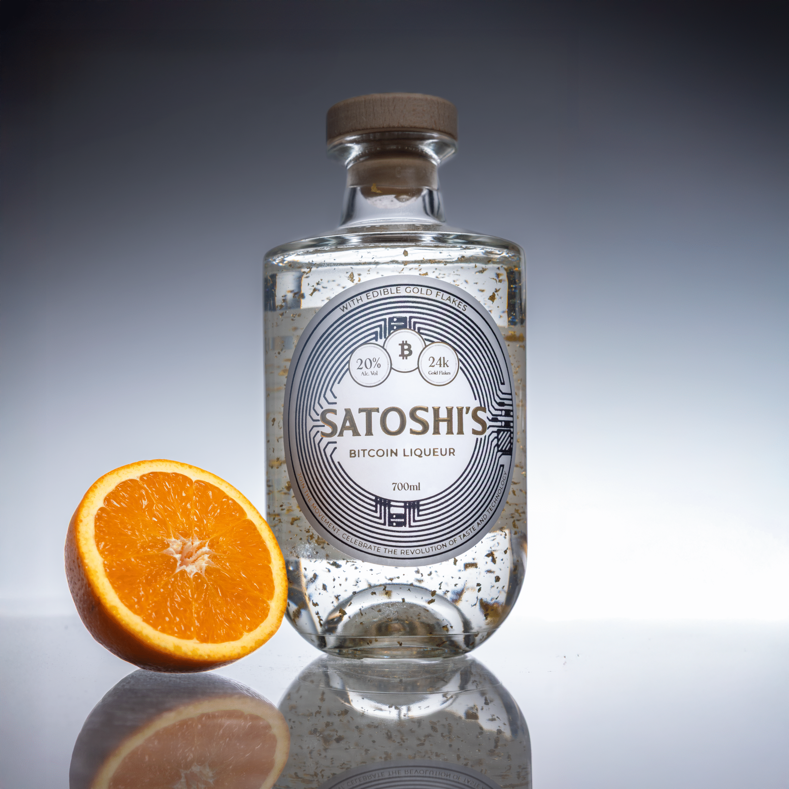 Elegant tall glass filled with clear liqueur, shot against a golden bokeh background to emphasise luxury cocktail branding.