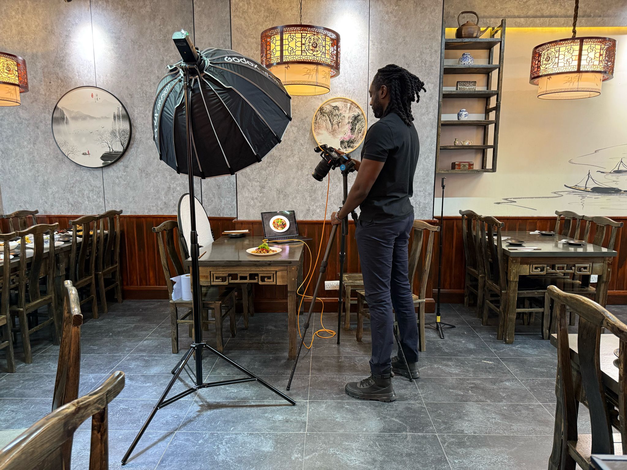 Professional photography studio setup with camera and lighting.