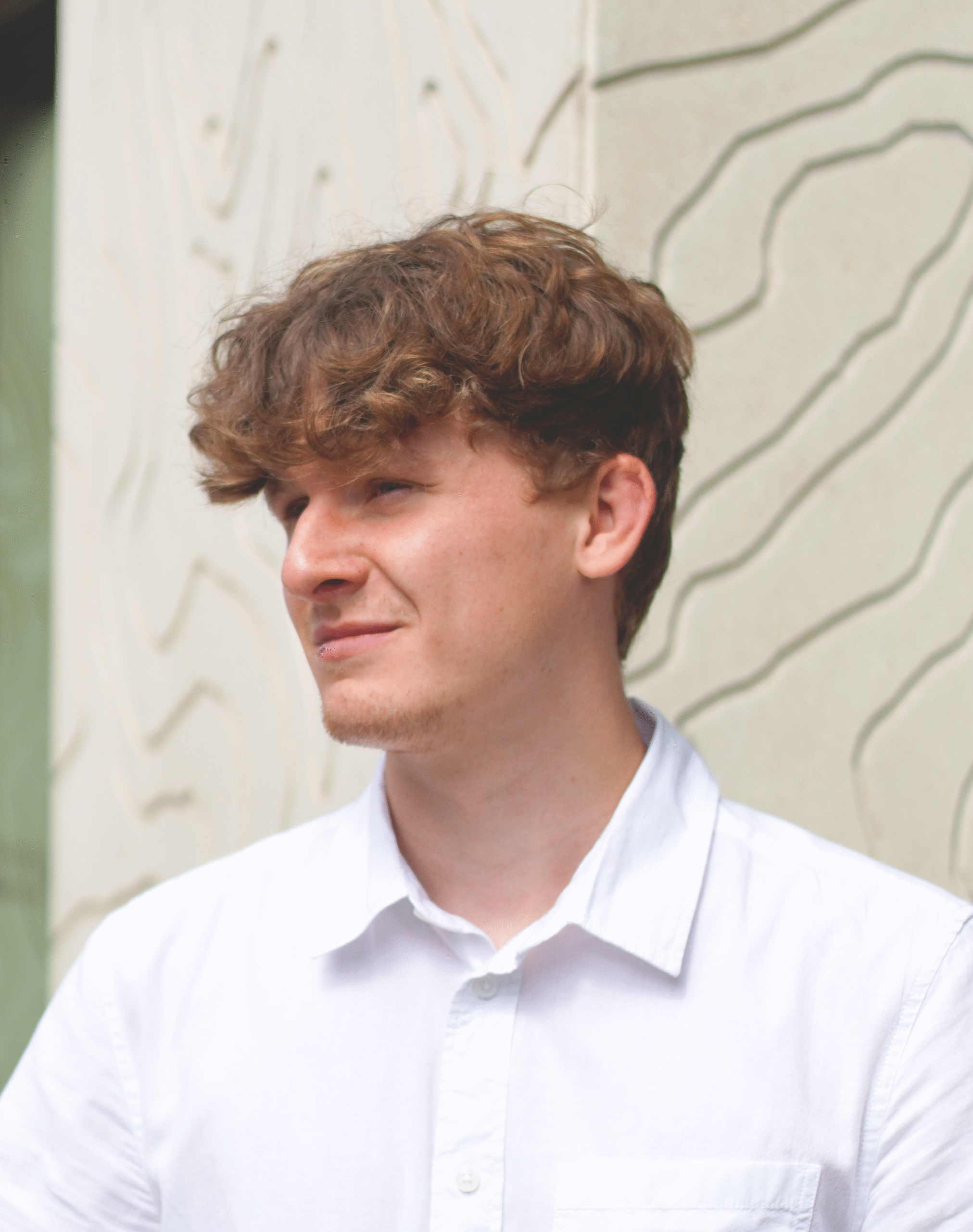 Headshot of white male looking away from the camera